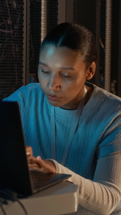 Female Engineer Programming on Computer in Data Center Stock Footage 311306087