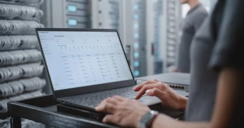 Female Engineer Responding to Critical Server Overheating Alert in Data Center Stock Footage 344954965