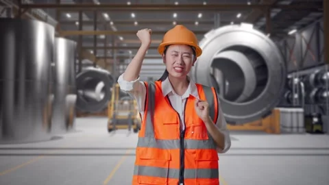 Female Engineer Screaming Goal And Dancing Celebrating at Heavy Factory Stock Footage 340823247