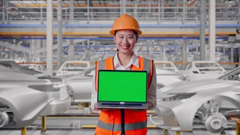 Female Engineer Showing Green Screen Laptop In Car Factory Stock Footage 331632041