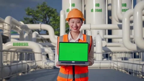 Female Engineer Showing Green Screen Laptop at Biodiesel plant Stock Footage 332104086