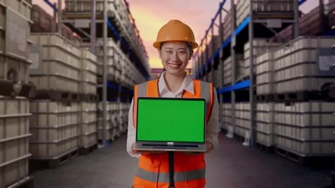 Female Engineer Showing Green Screen Laptop at Fuel Warehouse Stock Footage 332155807