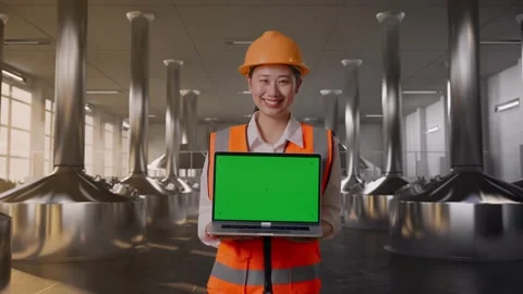 Female Engineer Showing Green Screen Laptop at Beer Plant Stock Footage 332546306