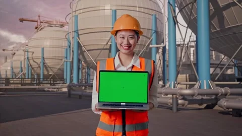 Female Engineer Showing Green Screen Laptop with Spherical Tank Stock Footage 335068506