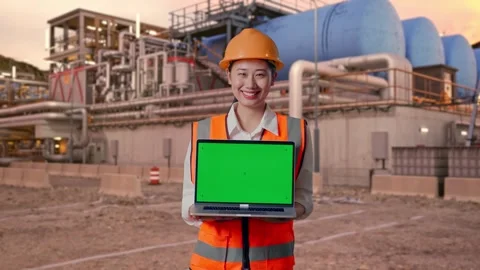 Female Engineer Showing Green Screen Laptop at Gas Plant Stock Footage 337762724