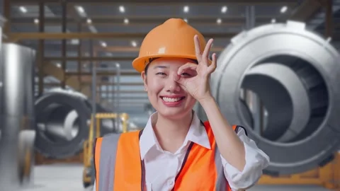 Female Engineer Showing Ok Hand Sign Over Eye at Heavy Factory 動画素材 340824862
