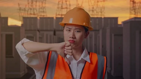 Female Engineer Showing Thumbs Down Gesture with High Voltage Power Vídeos de archivo 331286045