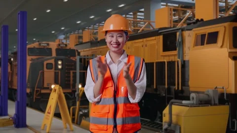 Female Engineer Smiling And Clapping Her Hands, Train Service Video stock 311239240