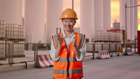 Female Engineer Smiling And Clapping Her Hands at Storage Facility Stock Footage 337754108