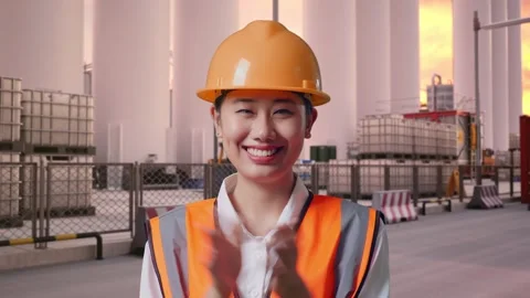 Female Engineer Smiling And Clapping Her Hands at Storage Facility Stock Footage 337755145