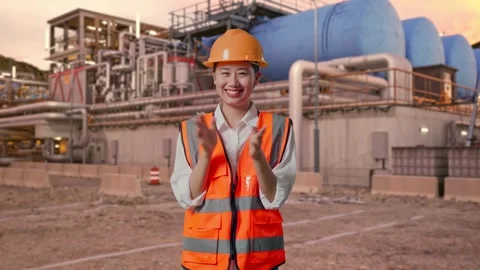Female Engineer Smiling And Clapping Her Hands at Gas Plant Stock Footage 337762929