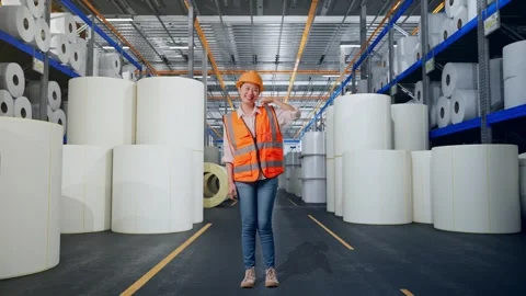 Female Engineer Smiling And Making Call Me Gesture at Polymer Plant Stock Footage 334533083