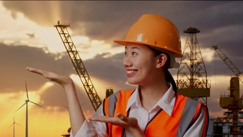 Female Engineer Smiling And Pointing To Side With Hydrogen Production Stock-Footage 280569440
