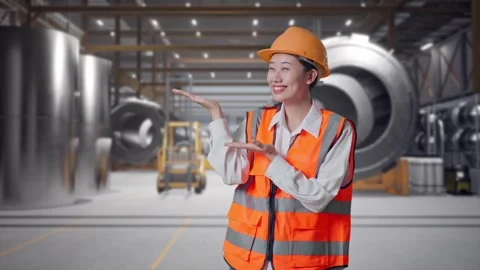 Female Engineer Smiling And Pointing To Side at Heavy Factory Stock Footage 340822652