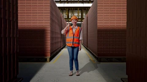 Female Engineer Smiling And Showing Thumbs Up Gesture With Brick In Stacks Stock Footage 303763213