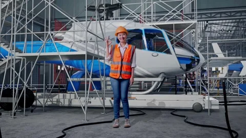 Female Engineer Smiling And Showing Okay Gesture and Inspecting Helicopter Stock Footage 312127380