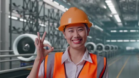 Female Engineer Smiling And Showing Okay Gesture, Aircraft Engine Factory Stock Footage 314608261