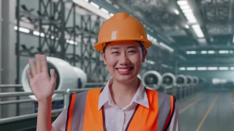 Female Engineer Smiling And Waving Hand Saying Bye, Aircraft Engine Factory Stock Footage 314608283
