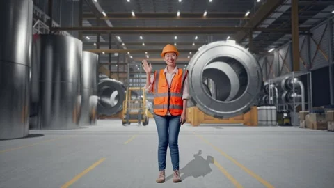 Female Engineer Smiling And Waving Hand Saying Bye at Heavy Factory Stock Footage 340825709