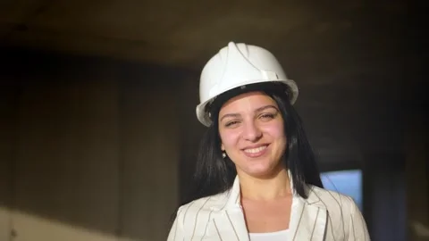 Female engineer smiling at construction site. Self-confident 스톡 동영상 240304455