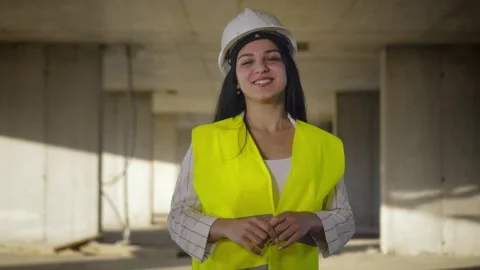 Female engineer smiling at construction site. Self-confident Stock Footage 240336847