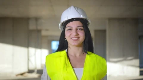 Female engineer smiling at construction site. Self-confident 動画素材 240336967