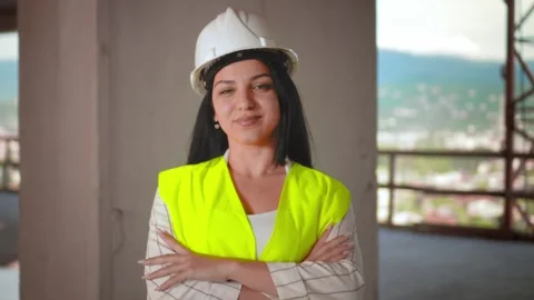 Female engineer smiling at construction site. Self-confident 库存影片 240336969
