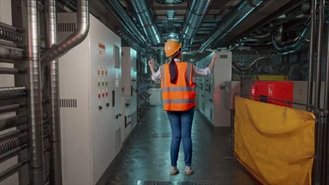 A Female Engineer Spreading Arms In Engine Control Room Stock Footage 292372105
