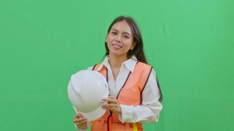 A female engineer taking off her safety helmet Stock-Footage 331625619
