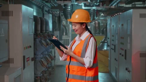 Female Engineer Taking Note On The Tablet In Engine Control Room Stock Footage 292368750
