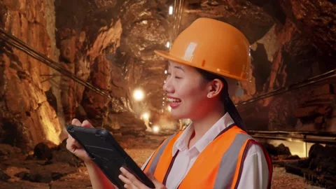 Female Engineer Taking Note On The Tablet In Mine Tunnel Stock Footage 299577387