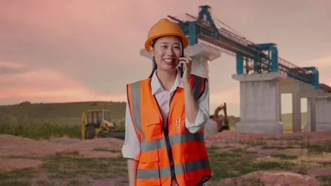 Female Engineer Talking On Smartphone at Construction Site Stock Footage 330332422
