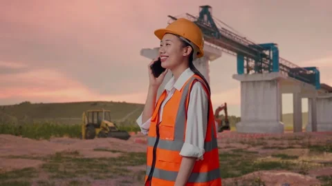Female Engineer Talking On Smartphone at Construction Site Stock Footage 330332718