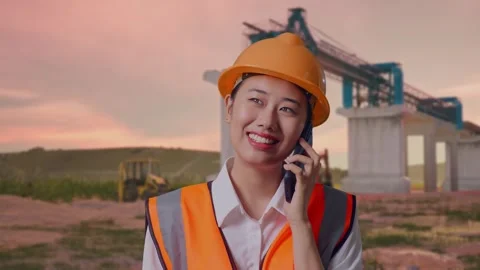 Female Engineer Talking On Smartphone at Construction Site Stock Footage 330333226