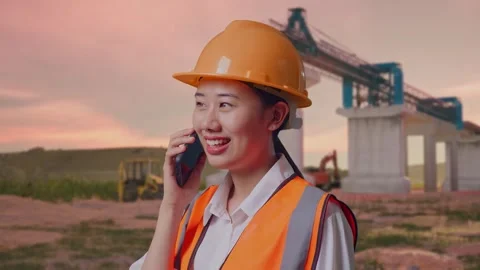 Female Engineer Talking On Smartphone at Construction Site Stock Footage 330333294