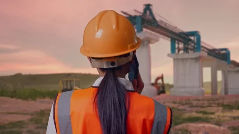 Female Engineer Talking On Smartphone at Construction Site Stock Footage 330333352