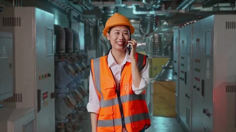 Female Engineer Talking On Smartphone In Engine Control Room Stock Footage 292368583