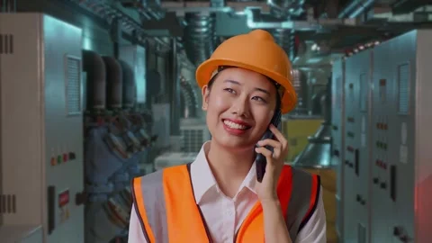 Female Engineer Talking On Smartphone In Engine Control Room Stock Footage 292369708