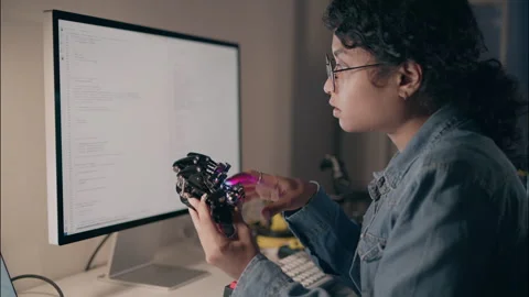 Female Engineer Testing Robotic Hand Prototype at Night. Video stock 307586723