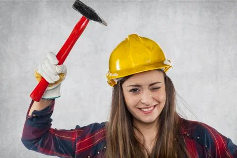 Female engineer is testing the strength of a helmet Stock Photos