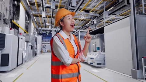 Female Engineer Thinking Then Raising Her Index Finger At Factory Digitalization Stock Footage 276929178