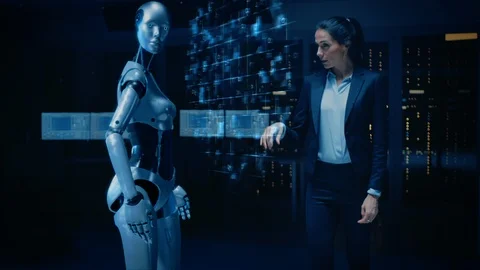 Female Engineer Touching Hands with Humanoid Robot Activating Collaboration Stock Footage 126825668
