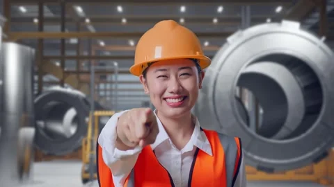 Female Engineer Touching Her Chest Then Pointing at Heavy Factory Stock Footage 340824778