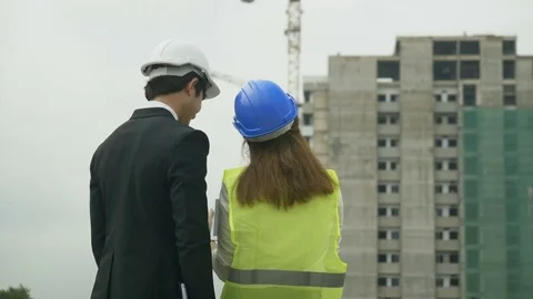 Female engineer using digital tablet, talking with customer Stock Footage 81603910