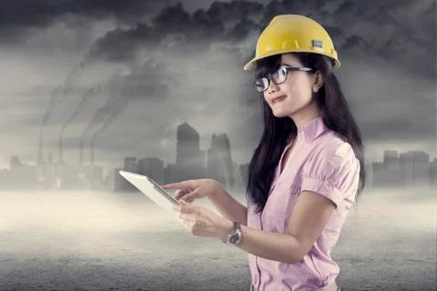 Female engineer using digital tablet outdoors Stock Photos