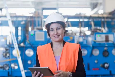 Female engineer using a digital tablet in an industrial plant 스톡 사진