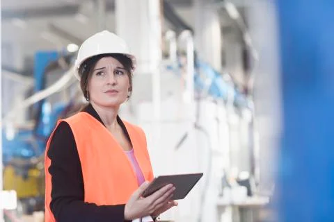 Female engineer using a digital tablet in an industrial plant 스톡 사진