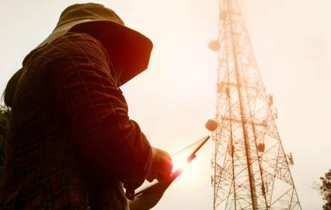 Female engineer using digital tablet checking the frequency of telecommunication Stock Photos