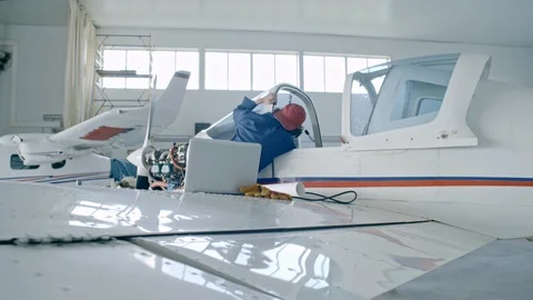 Female Engineer Using Laptop While Testing Airplane Engine Stock Footage 85544113