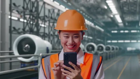 Female Engineer Using Smartphone, Aircraft Engine Factory Stock Footage 314608563